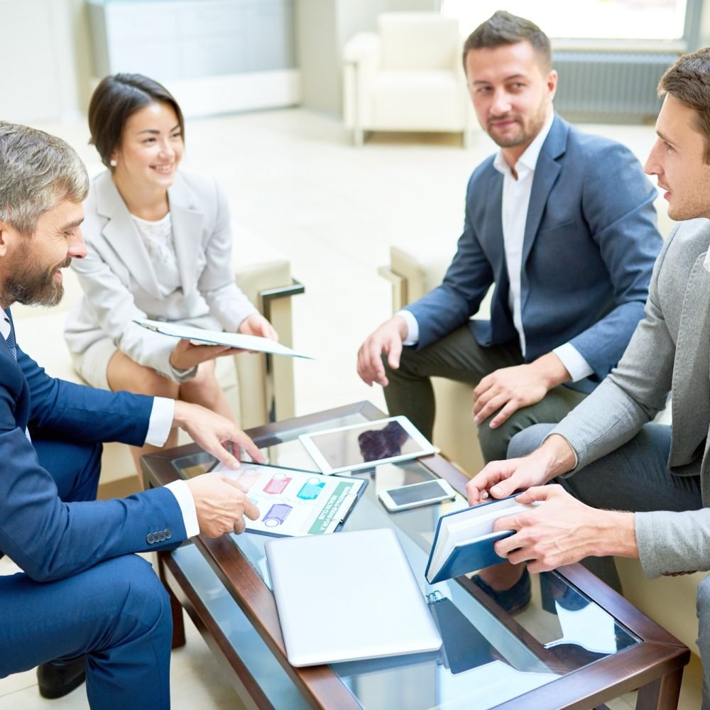 team-of-cheerful-business-people-in-meeting.jpg